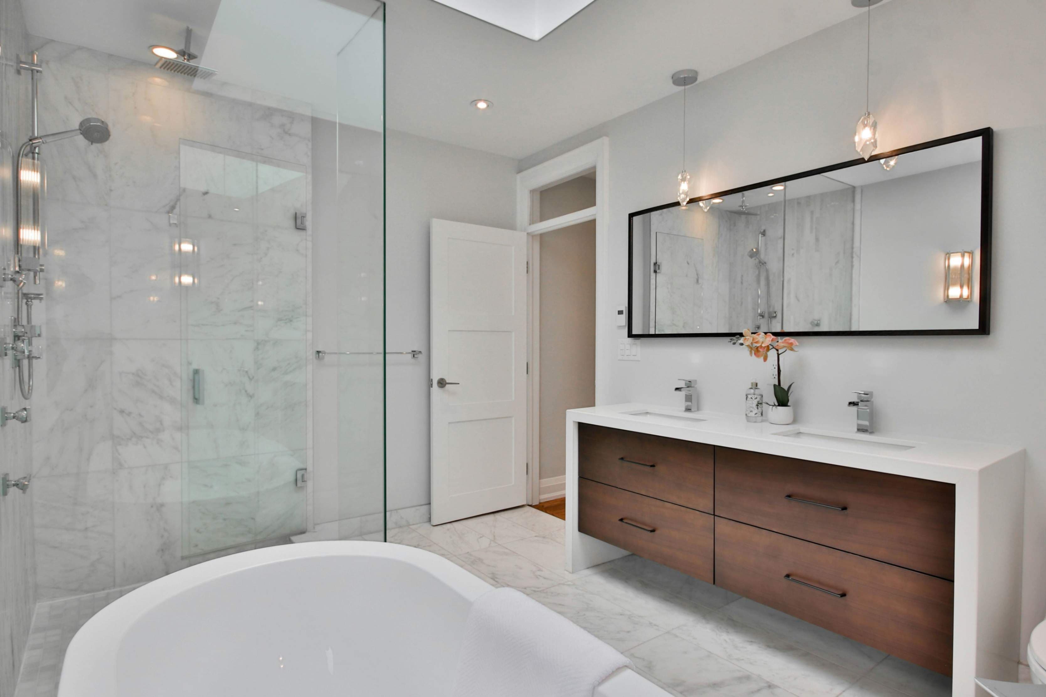 Luxury modern bathroom renovation with walk-in rain shower by Prime Bathroom and Kitchen   Renovation