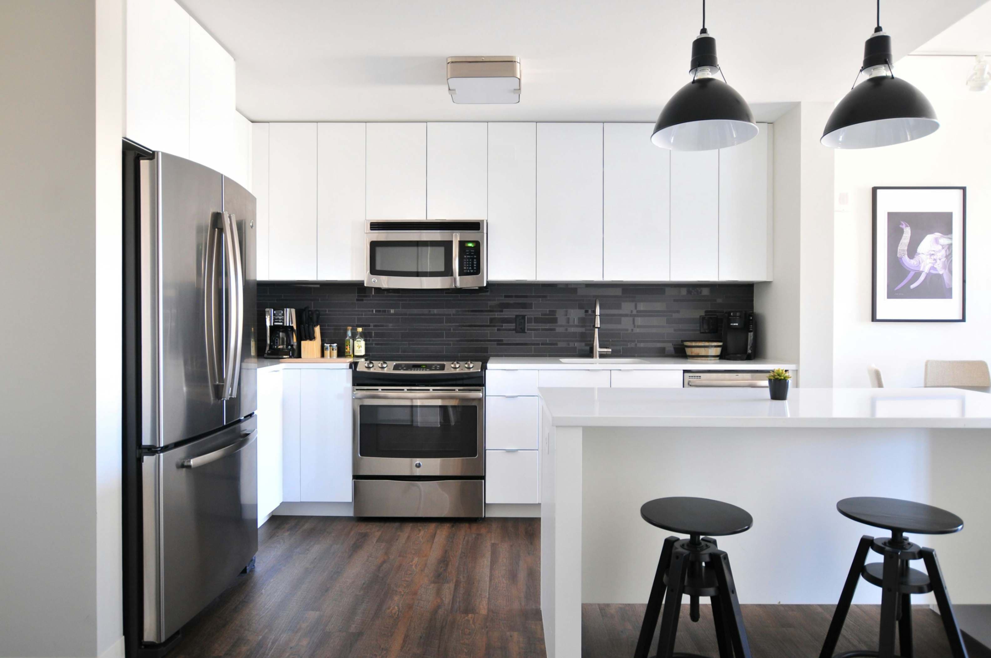 Modern open-plan kitchen fitting with premium custom cabinetry